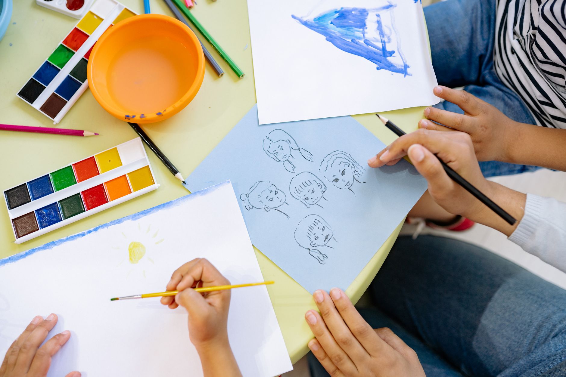 Child concentrating on a painting