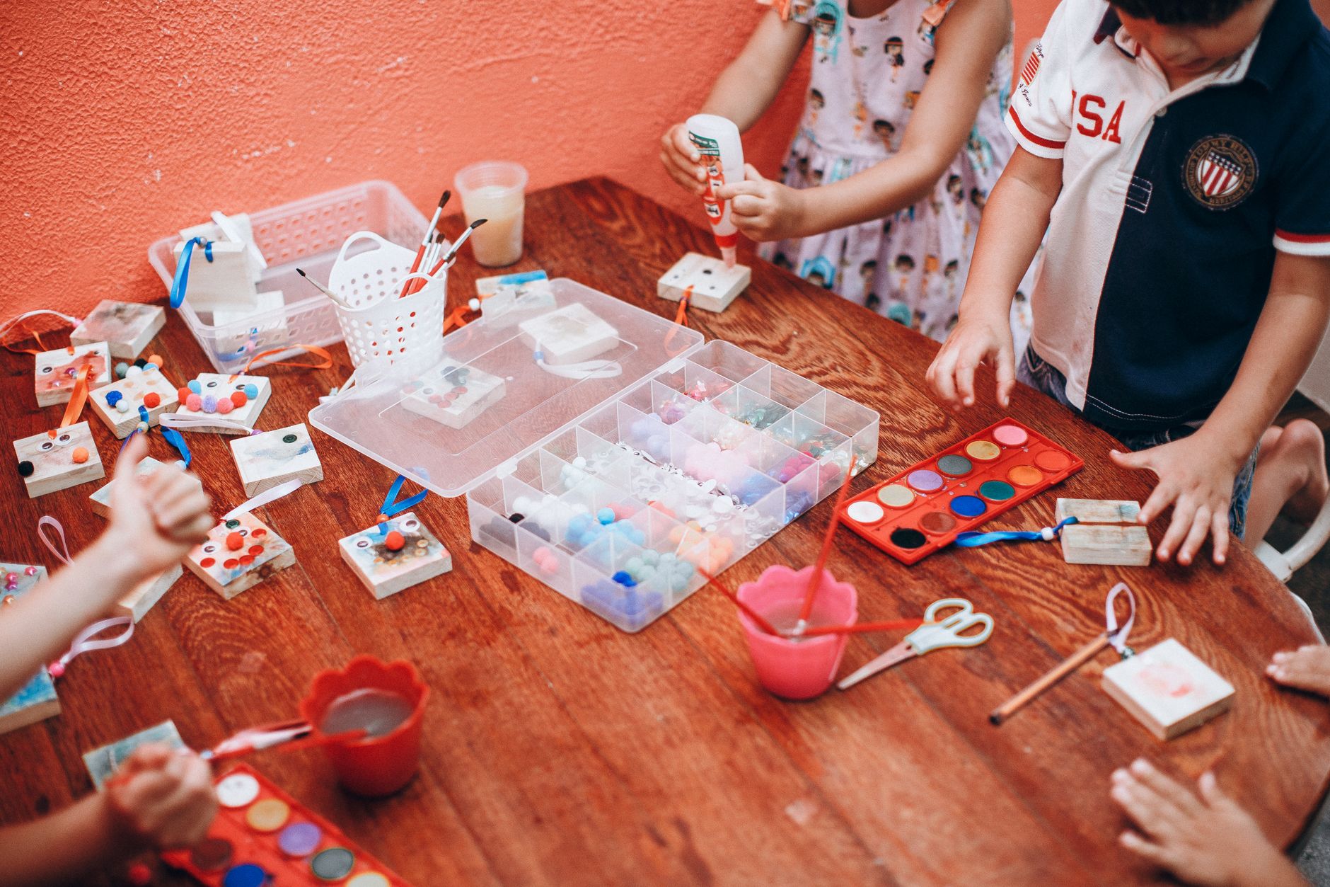 Children painting together at a preschool table