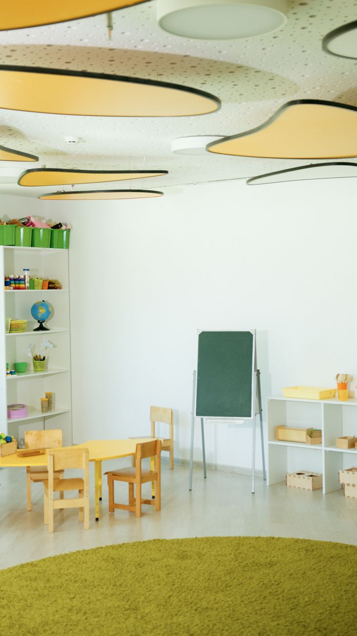 Smiling child in a colourful classroom