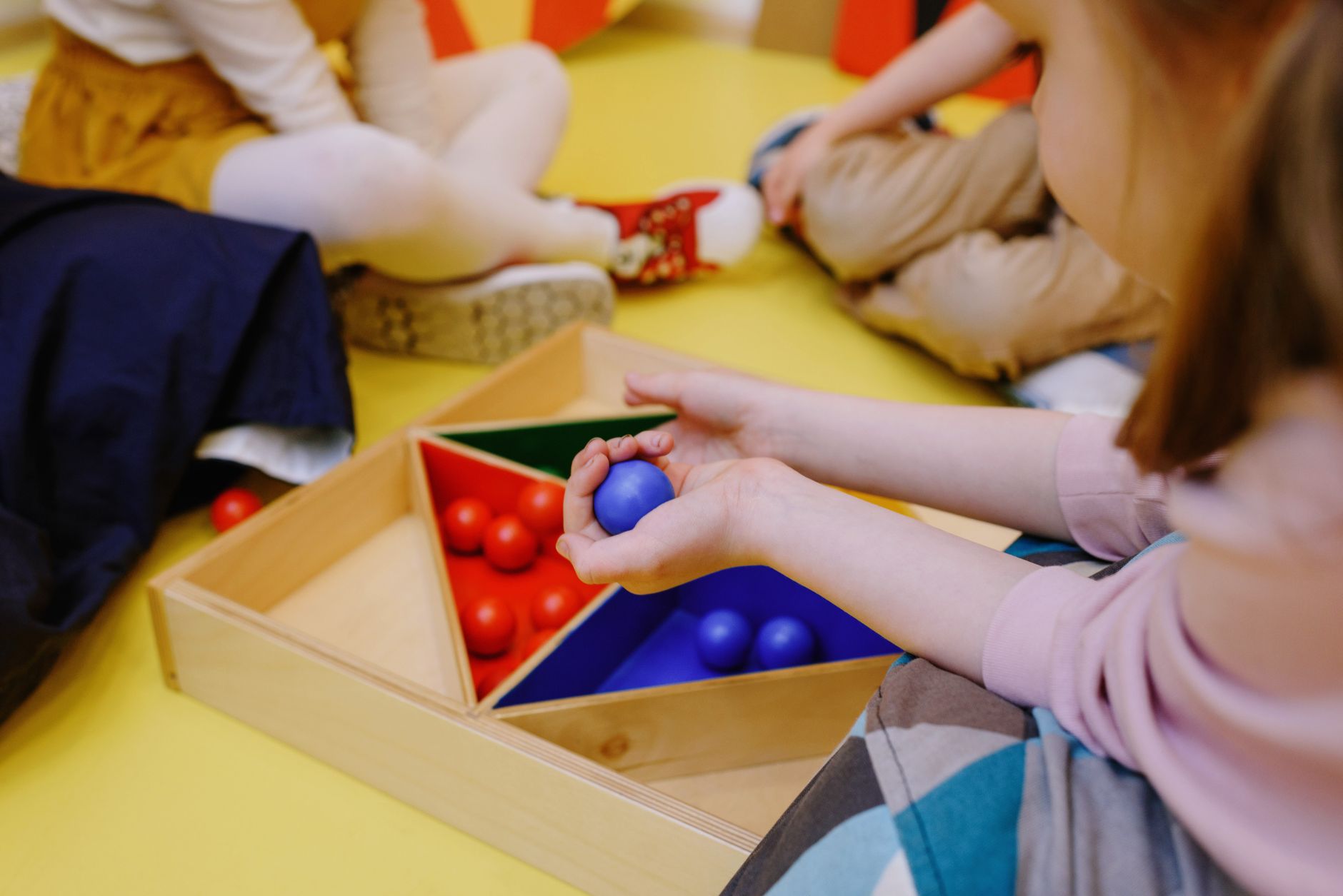 Children playing together in a bright classroom
