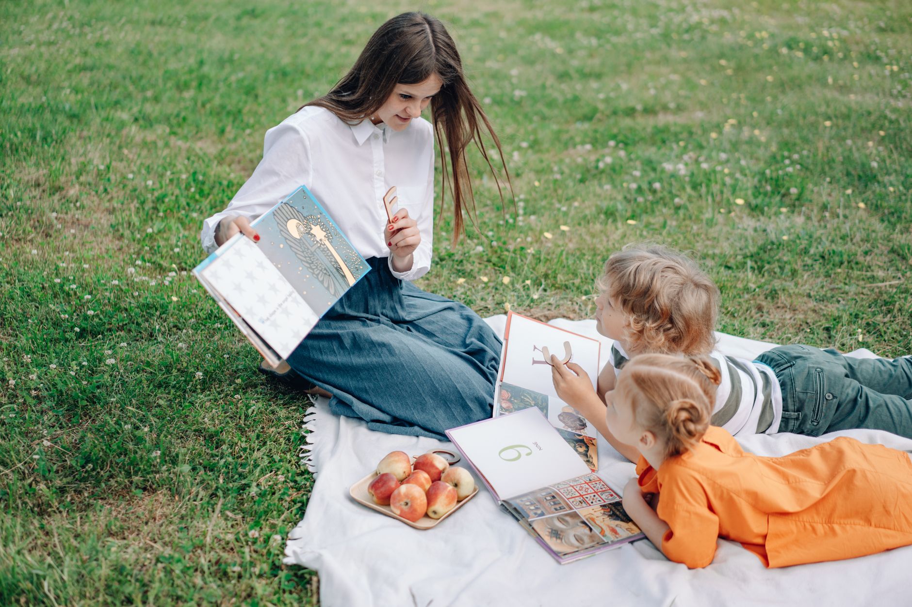 Children gathered around a caregiver at story time
